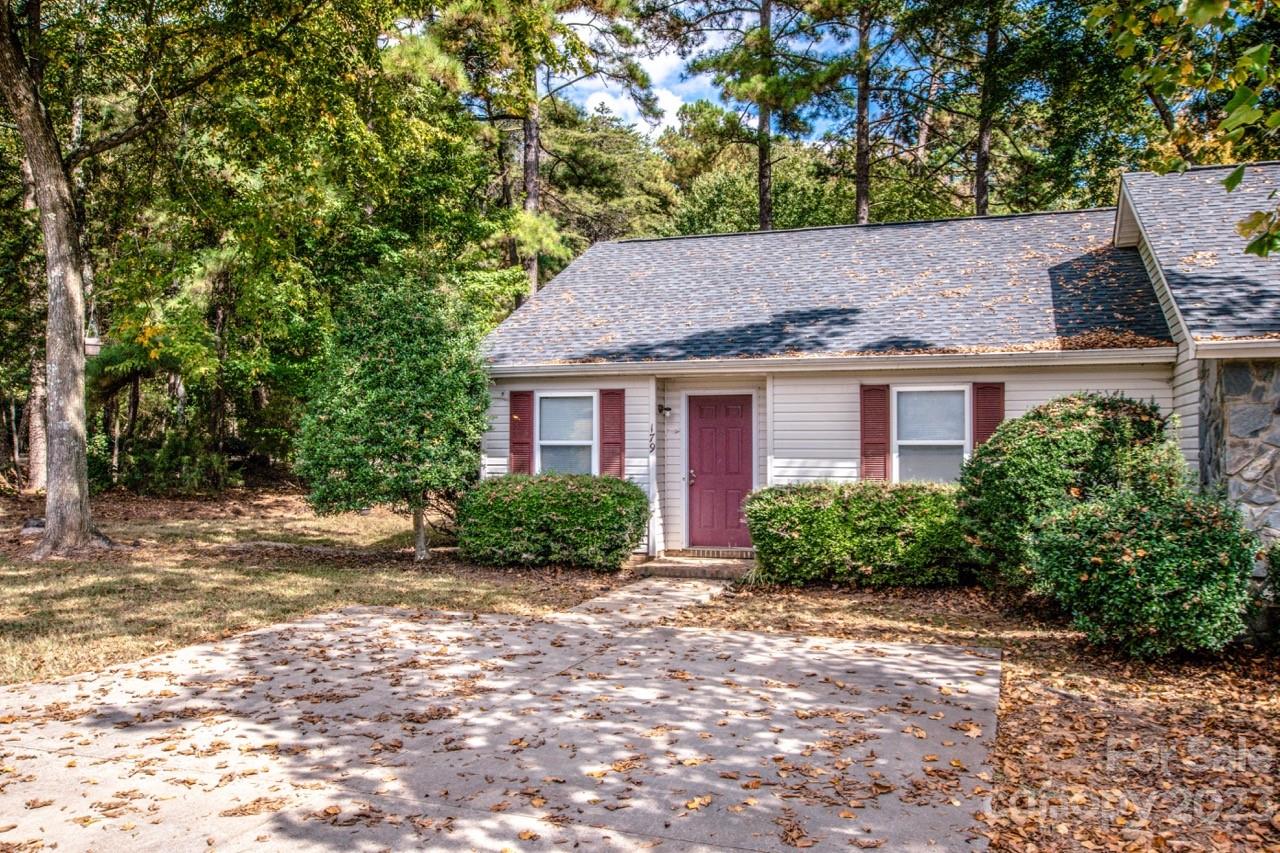 179 Isle Of Pines Road Mooresville, NC 28117 - Photo 19 of 25 a front view of a house with a garden