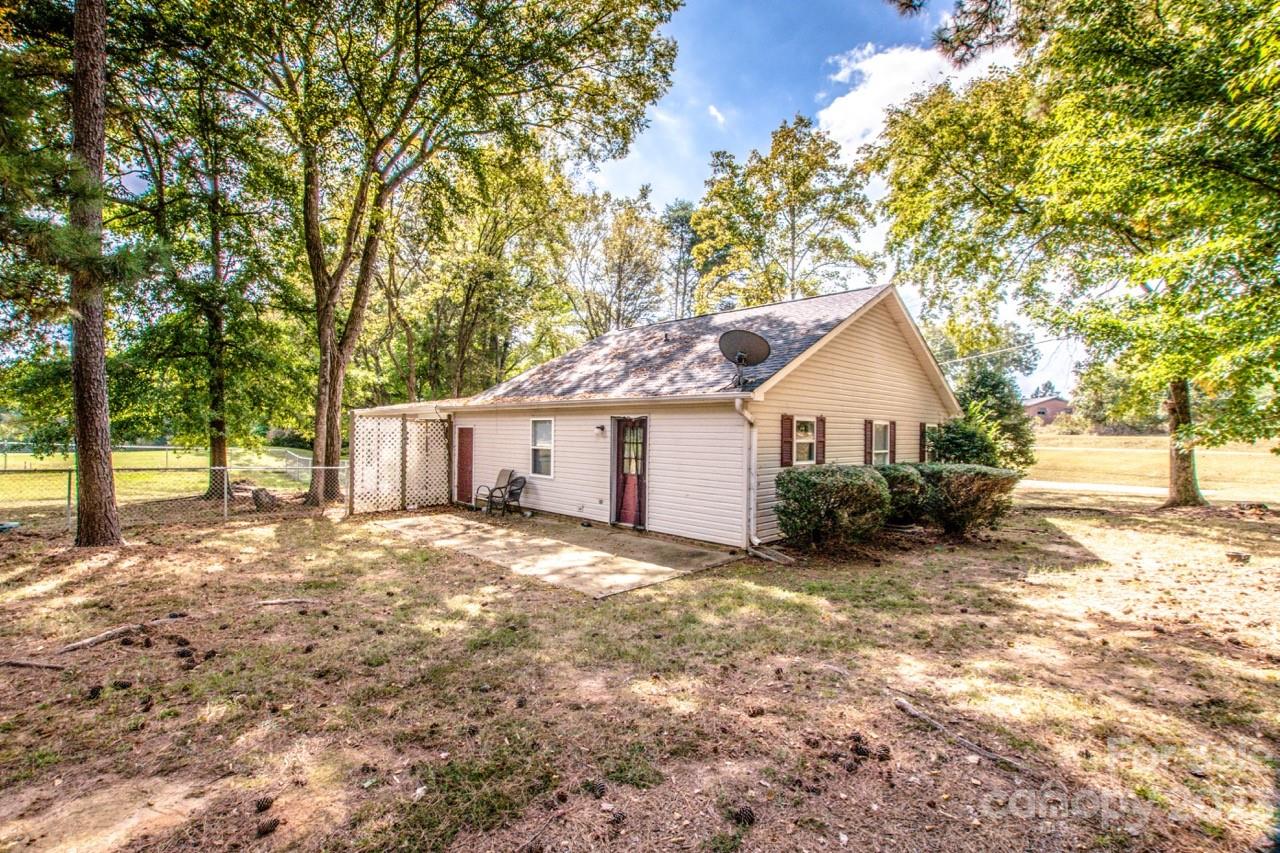 179 Isle Of Pines Road Mooresville, NC 28117 - Photo 22 of 25 a view of a house with a yard