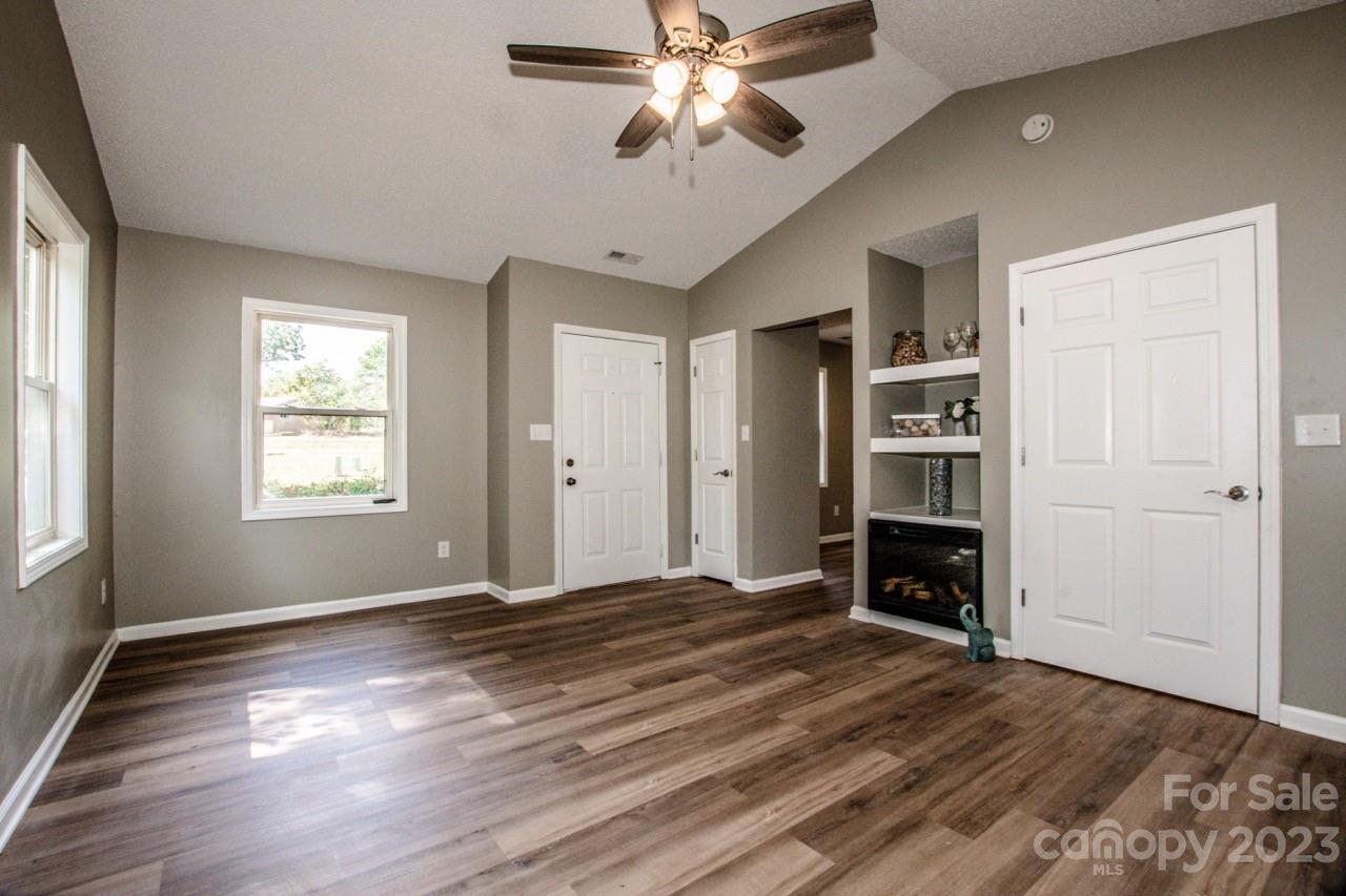 179 Isle Of Pines Road Mooresville, NC 28117 - Photo 4 of 25 a view of empty room with wooden floor and fan