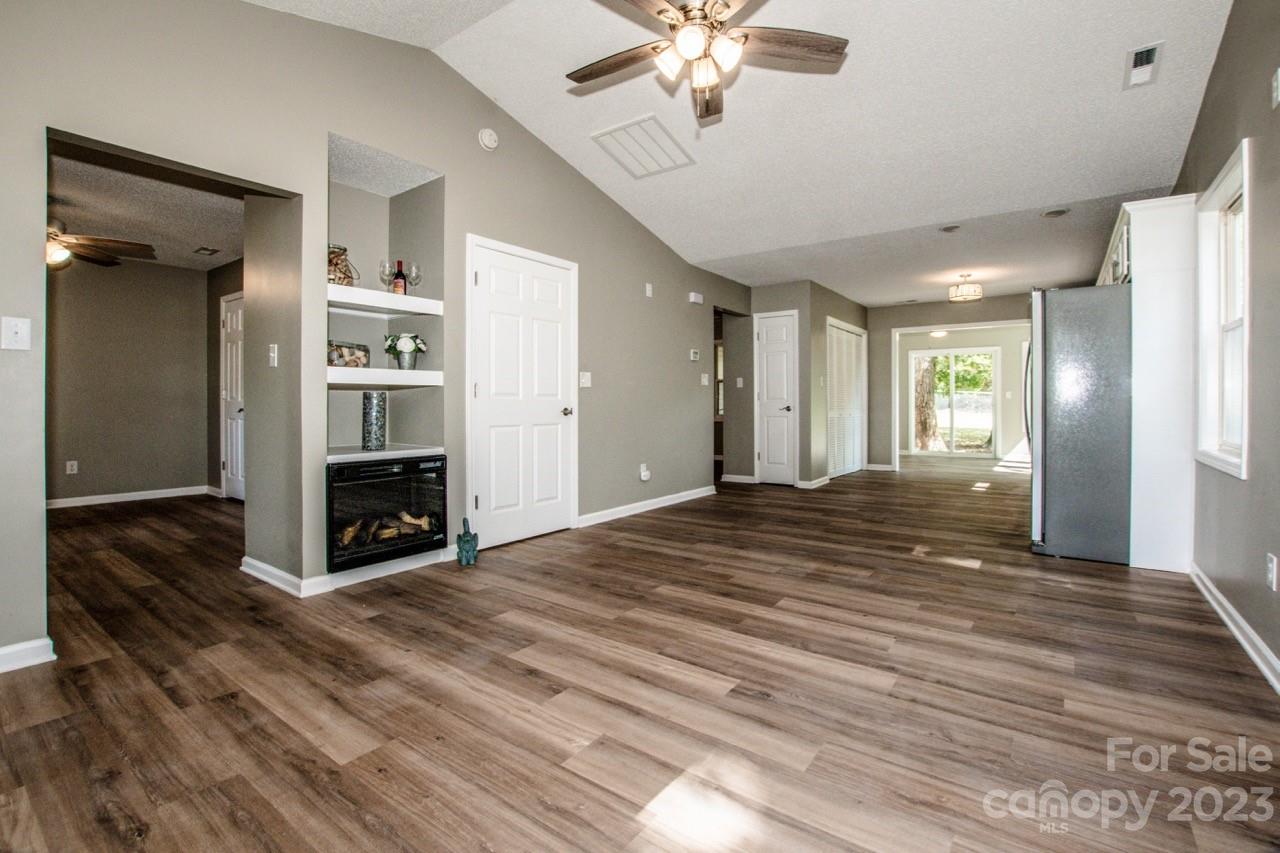 179 Isle Of Pines Road Mooresville, NC 28117 - Photo 5 of 25 a view of a livingroom with wooden floor