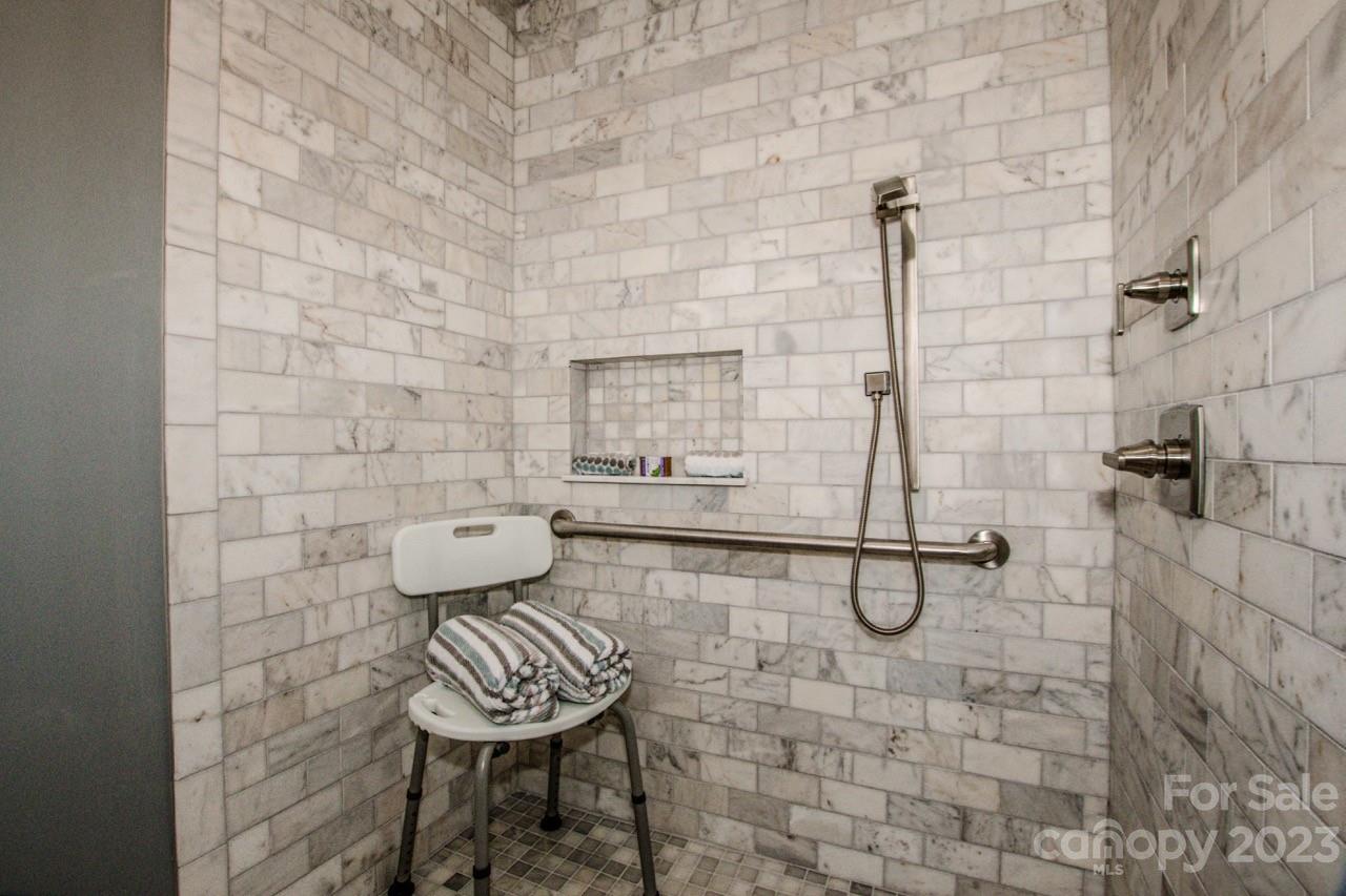 179 Isle Of Pines Road Mooresville, NC 28117 - Photo 9 of 25 a bathroom with a toilet and a shower