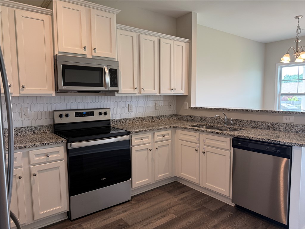 117 Weaver Way Pendleton, SC 29670 - Photo 4 of 19 A well-appointed kitchen features white cabinetry and sleek stainless steel appliances for effortless meal preparation.