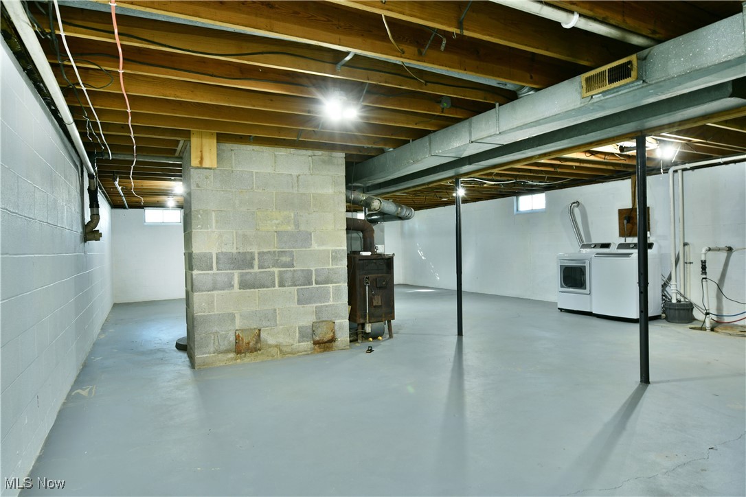 4461 Ridge Road Cortland, OH 44410 - Photo 40 of 47 Basement featuring heating unit and washing machine and clothes dryer