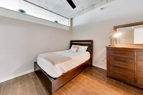 a bedroom with a bed and a cabinets