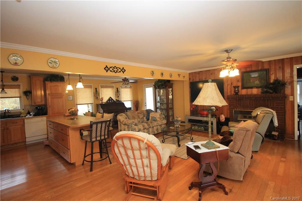1748 Boyd Road Blackstock, SC 29014 - Photo 15 of 24 a living room with fireplace furniture and a table