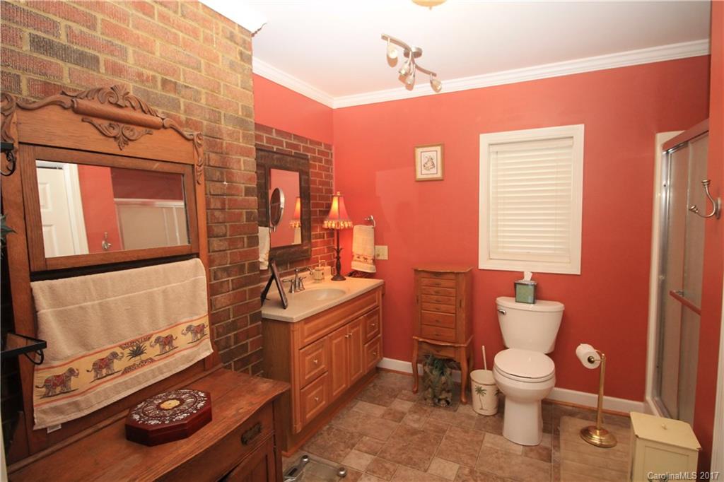 1748 Boyd Road Blackstock, SC 29014 - Photo 22 of 24 a bathroom with a sink toilet and mirror