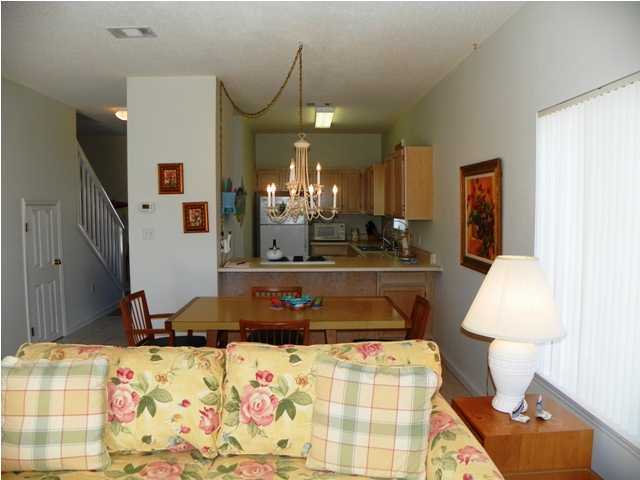 209 Blue Mountain Beach Road, Unit 401 Santa Rosa Beach, FL 32459 - Photo 3 of 8 a bedroom with a bed and lamp