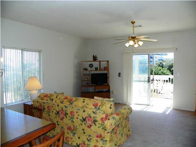 209 Blue Mountain Beach Road, Unit 401 Santa Rosa Beach, FL 32459 - Photo 4 of 8 a bedroom with furniture and a window