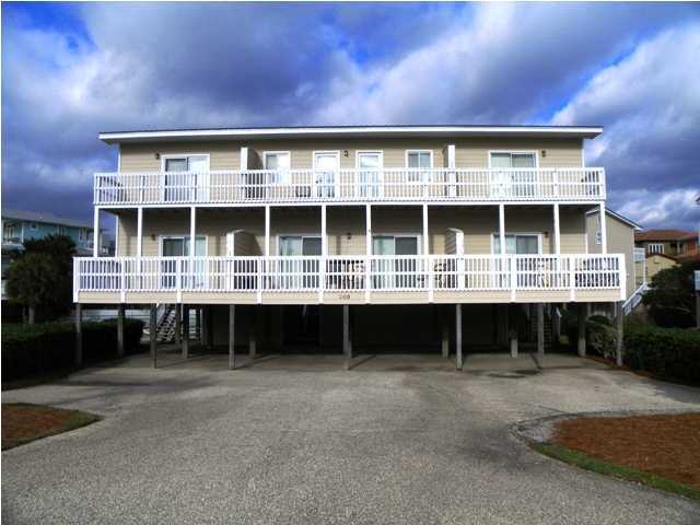 209 Blue Mountain Beach Road, Unit 401 Santa Rosa Beach, FL 32459 - Photo 8 of 8 a front view of a house with a yard