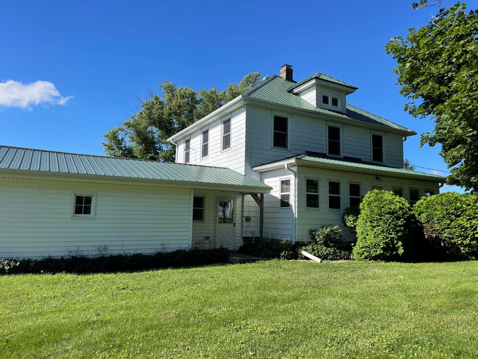 3076 Alworth Road Winnebago, IL 61088 - Photo 1 of 28 a front view of a house with a yard