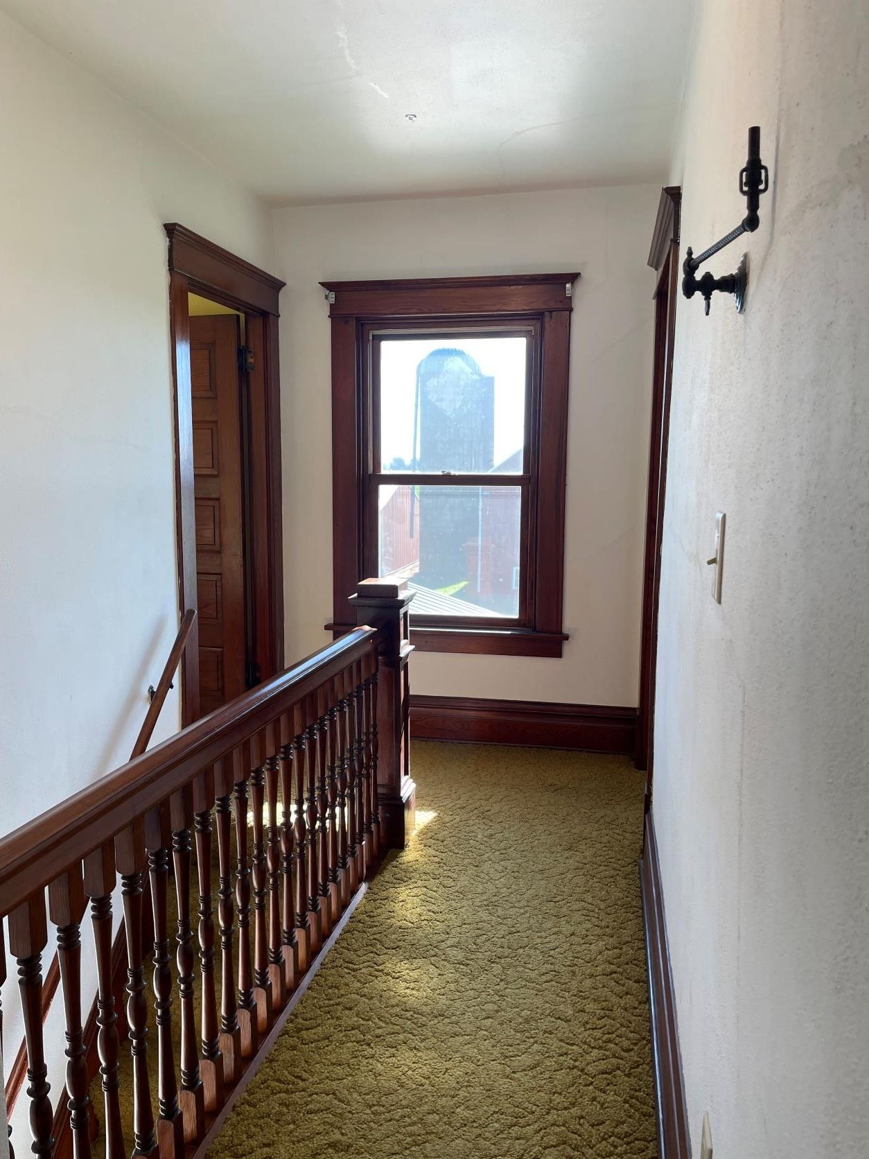 3076 Alworth Road Winnebago, IL 61088 - Photo 13 of 28 a view of a room with wooden floor and windows
