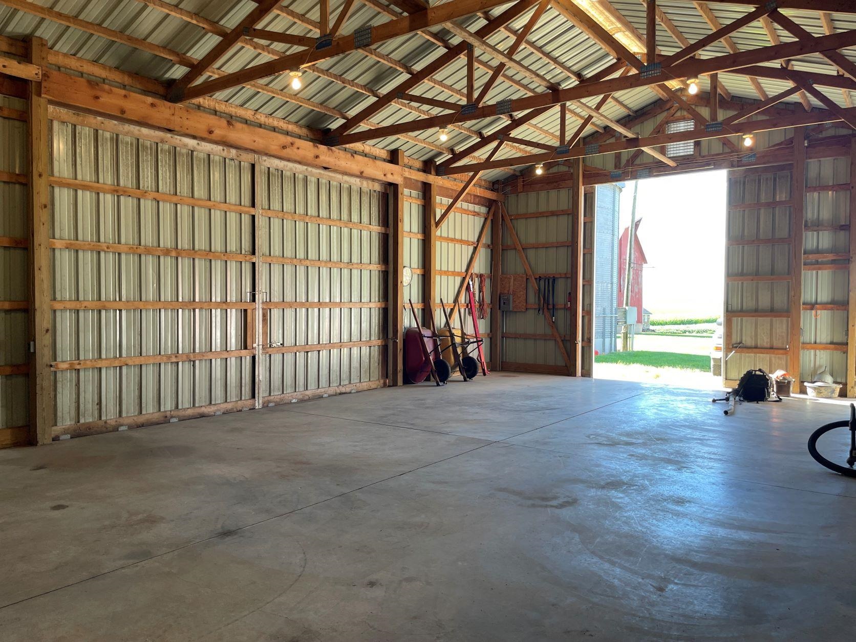 3076 Alworth Road Winnebago, IL 61088 - Photo 23 of 28 a view of an empty room with a fireplace and windows