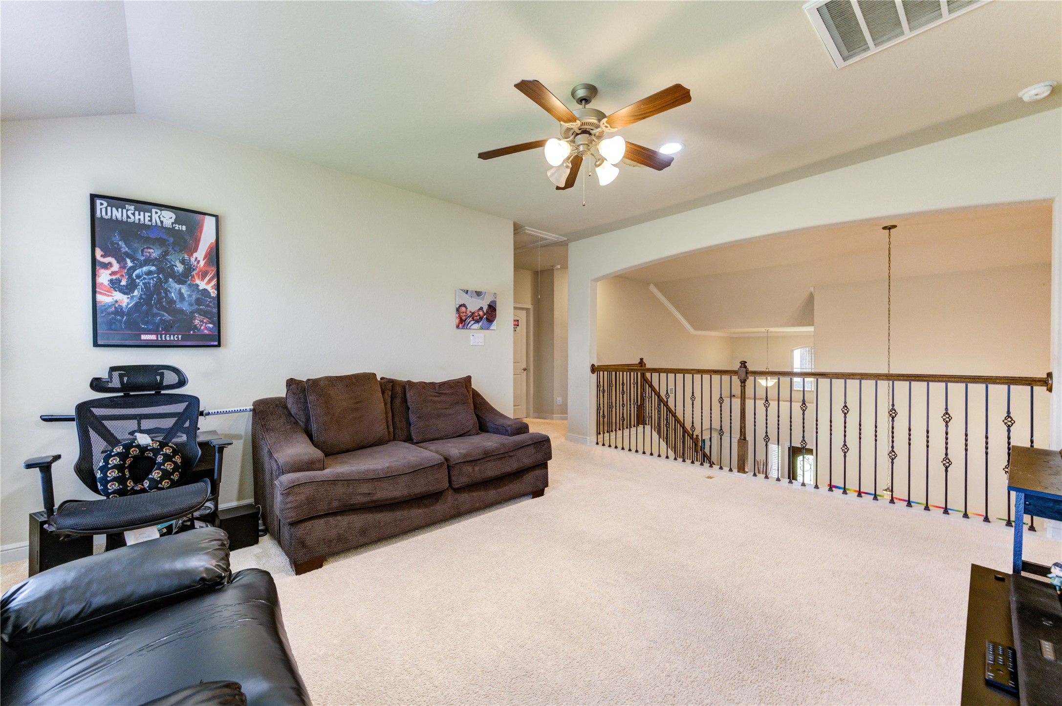 24511 Stratton Creek Drive Spring, TX 77373 - Photo 23 of 27 Spacious Game Room – Filled with natural light, this versatile upstairs game room offers plenty of space for movie nights, games, homework, or simply relaxing with family and friends.