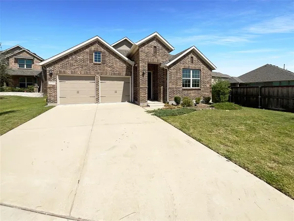 a front view of a house with yard