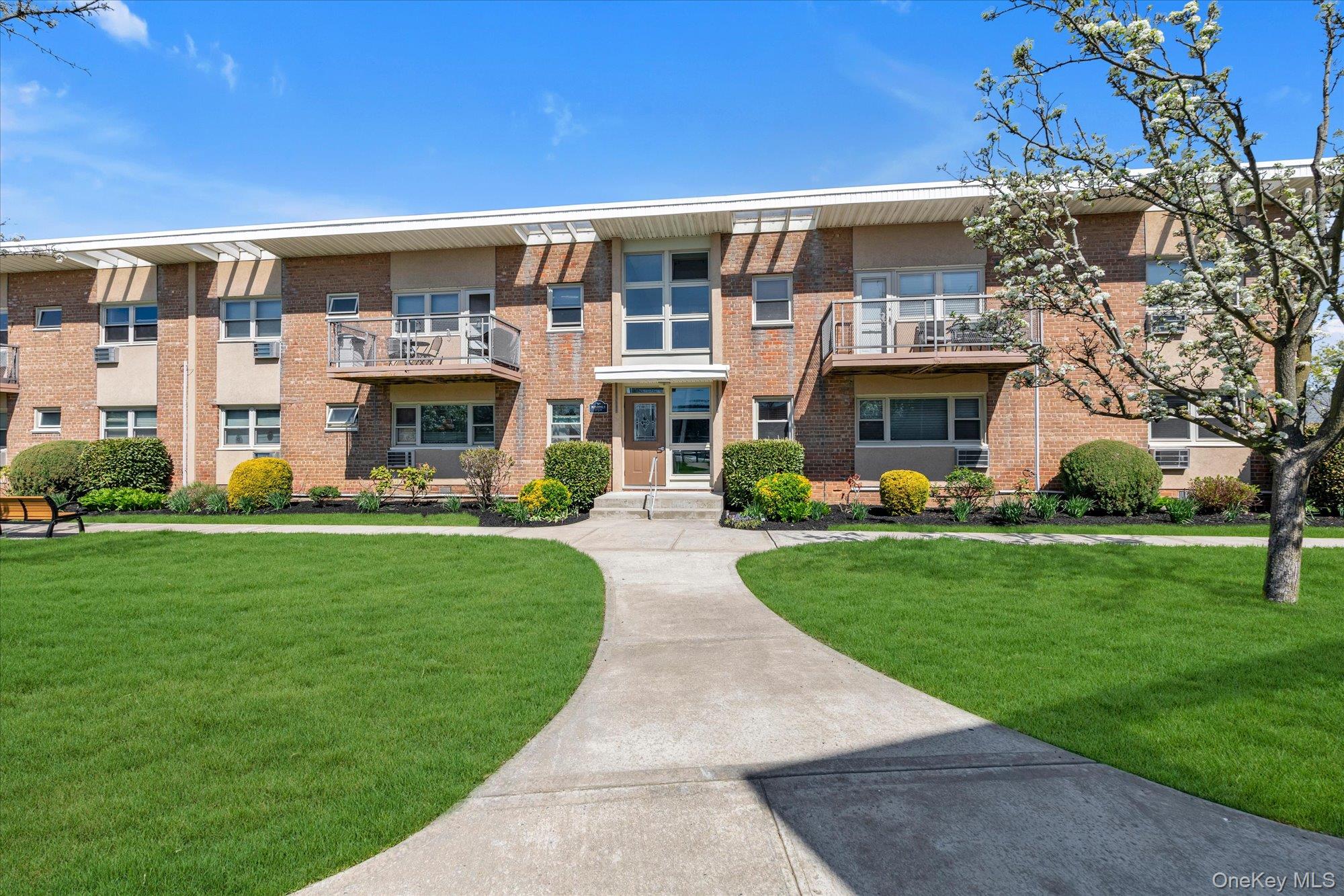 a front view of building with yard