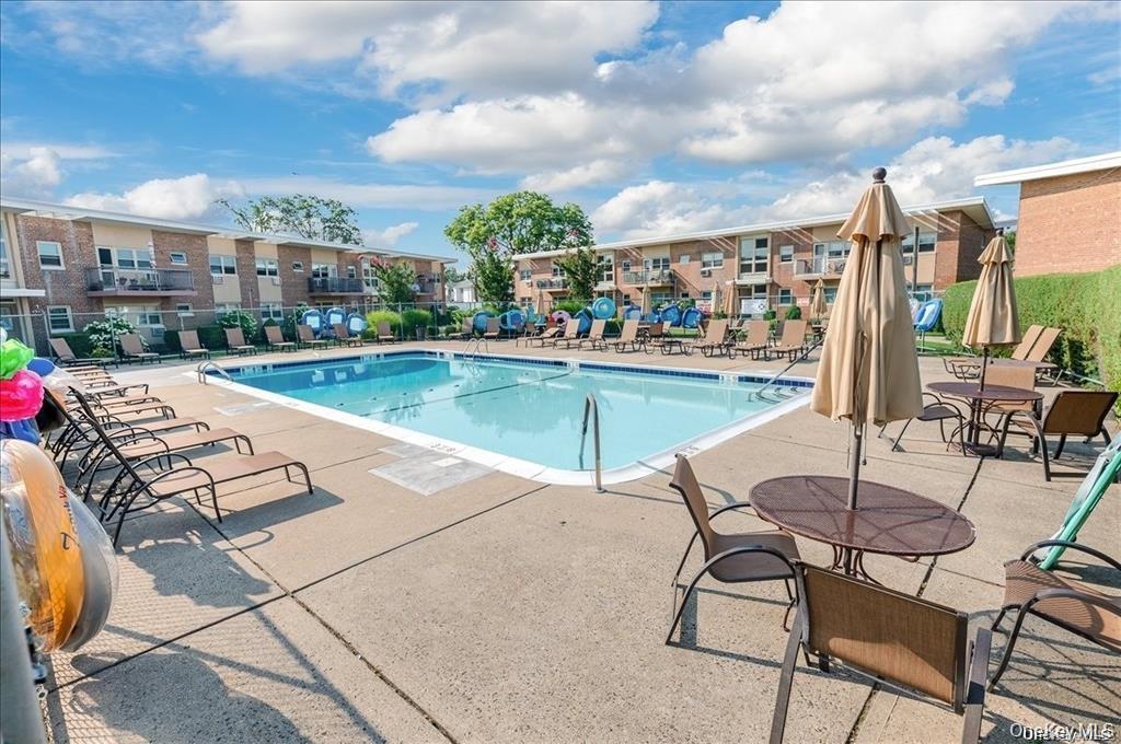4 Rose Street, Unit 5H1 Oceanside, NY 11572 - Photo 14 of 18 a view of a terrace with sitting area