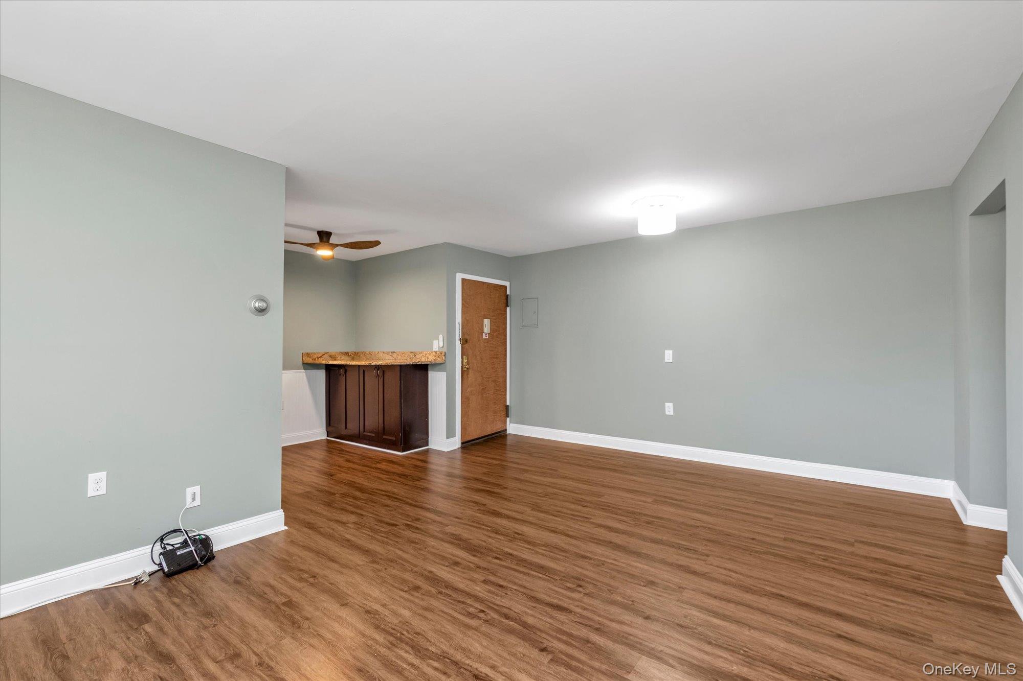 4 Rose Street, Unit 5H1 Oceanside, NY 11572 - Photo 4 of 18 a view of a room with wooden floor