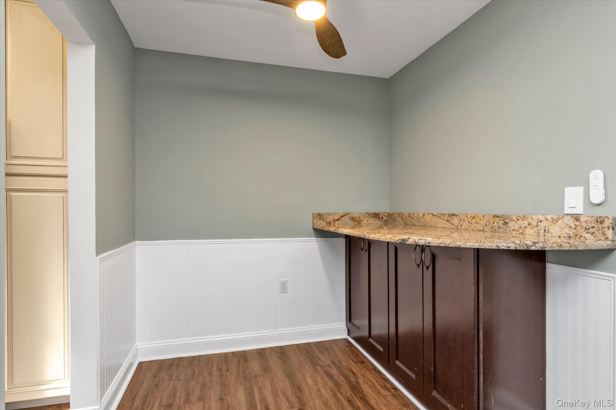 4 Rose Street, Unit 5H1 Oceanside, NY 11572 - Photo 5 of 18 a view of kitchen with furniture and wooden floor
