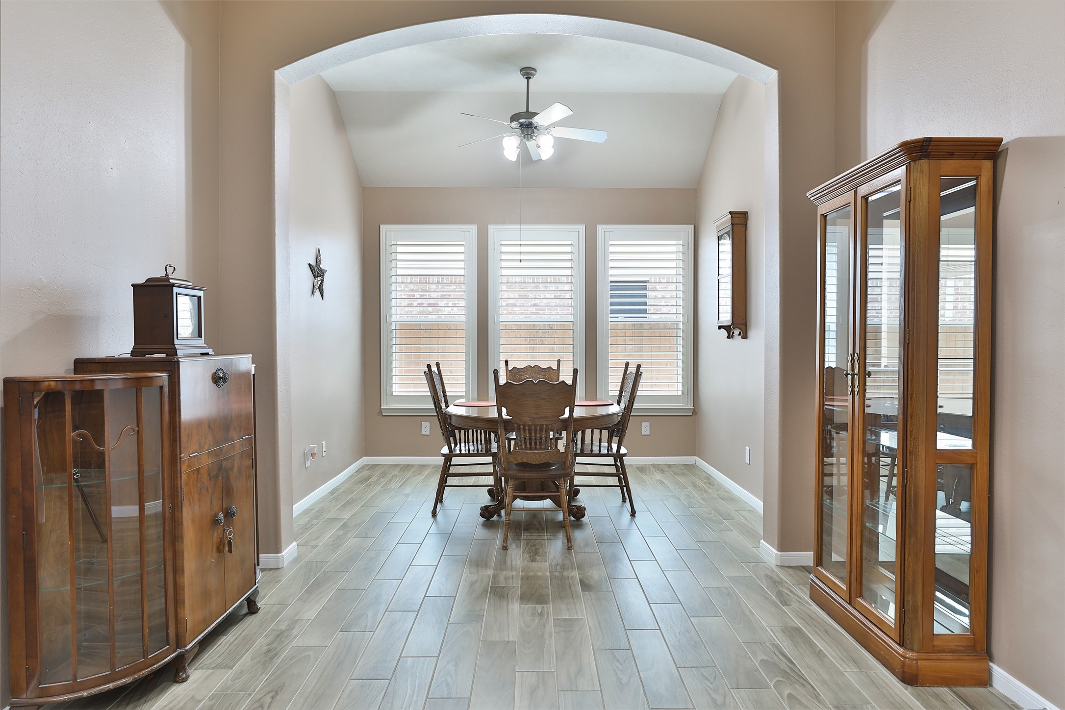 20519 Windrose Bend Drive Spring, TX 77379 - Photo 16 of 37 Eat-in breakfast room located adjacent to the kitchen, providing direct access to an open sunroom/flex space. The versatility of this area allows for a variety of creative uses to suit your lifestyle needs.