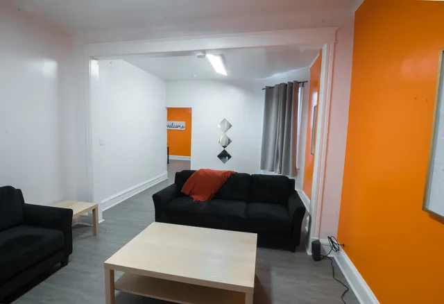 a living room with furniture and a window