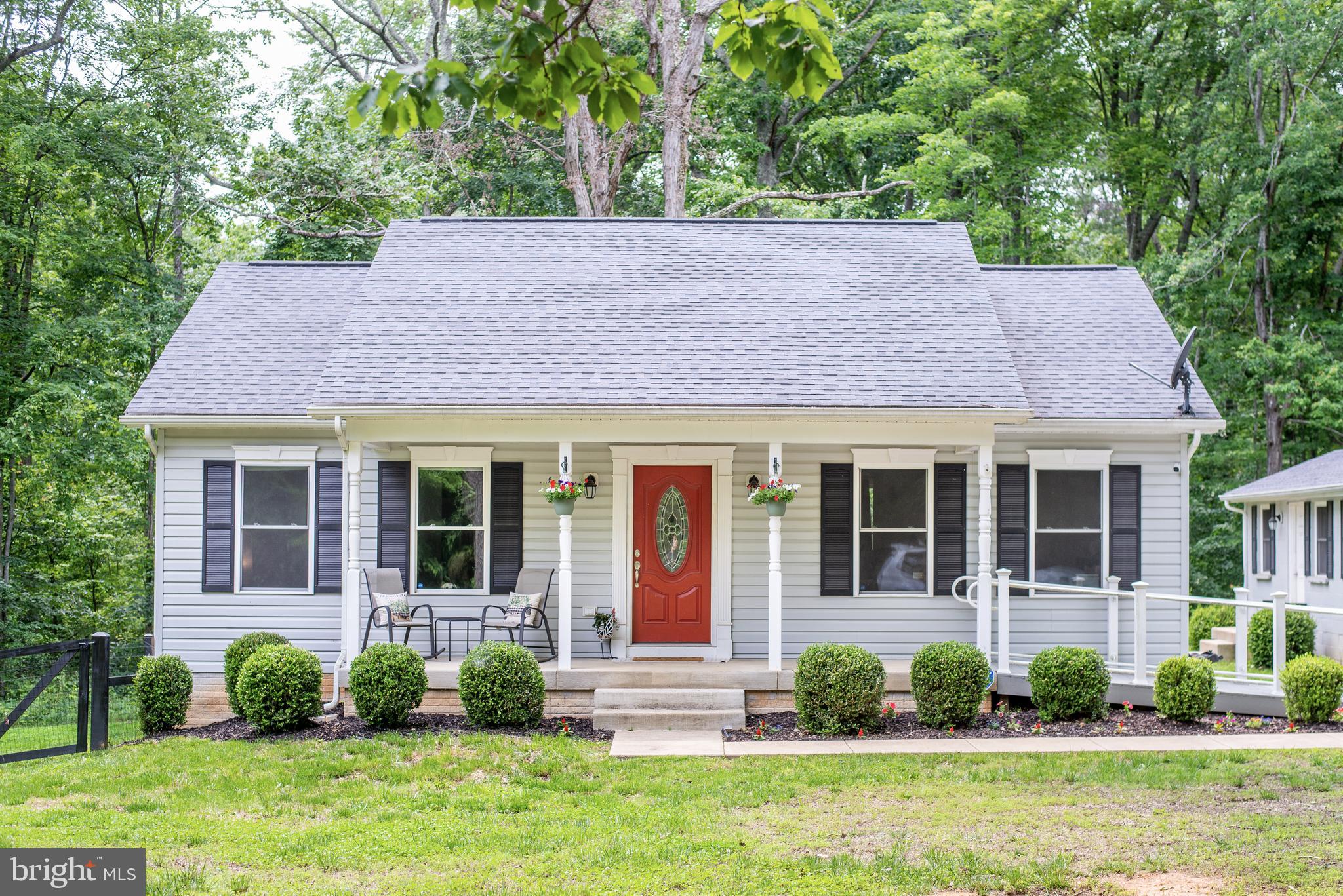 5588 Courtneys Corner Road Sumerduck, VA 22742 - Photo 1 of 22 a front view of a house with garden