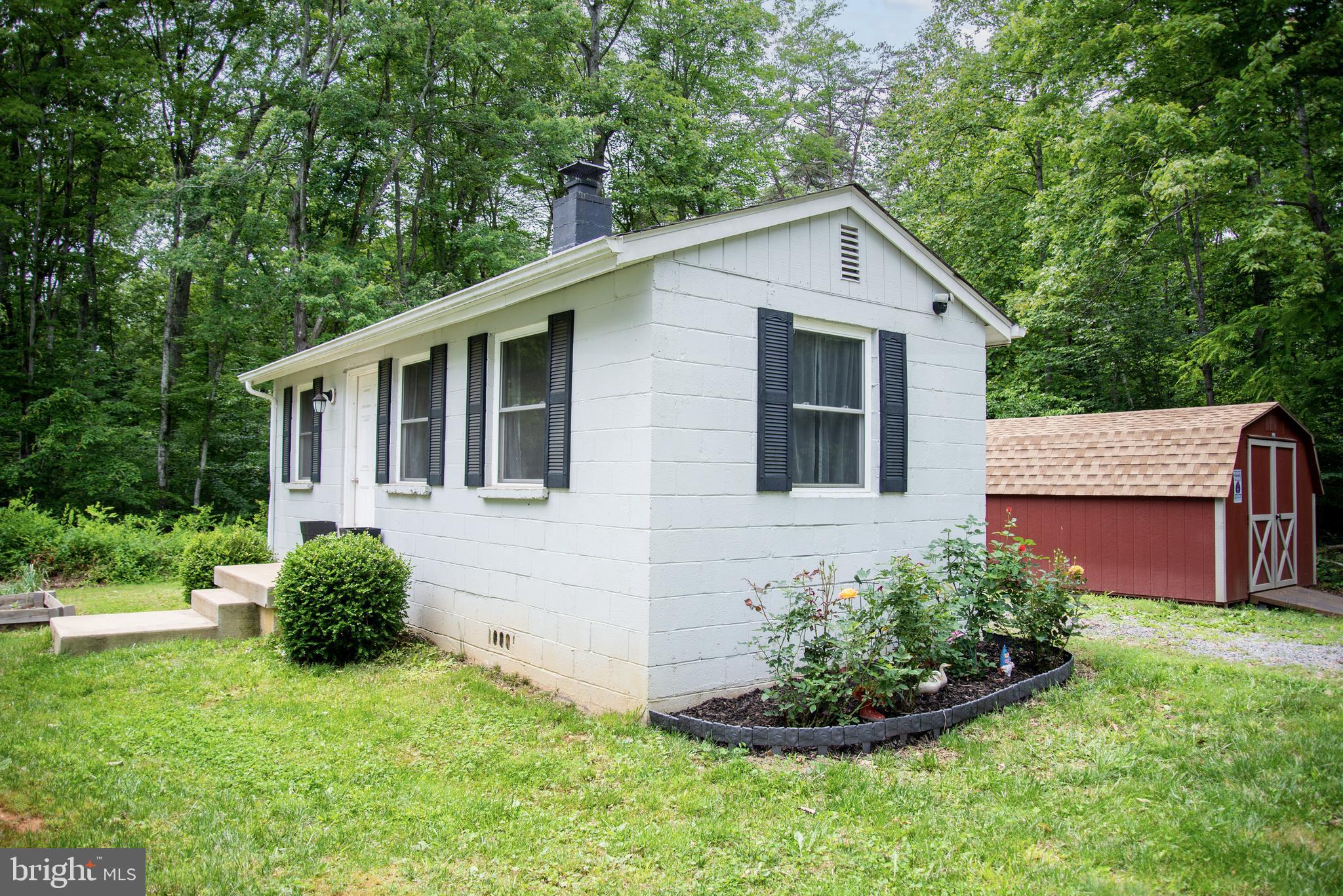 5588 Courtneys Corner Road Sumerduck, VA 22742 - Photo 20 of 22 a front view of a house with a yard