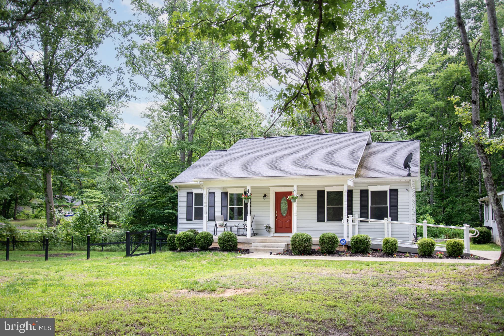 5588 Courtneys Corner Road Sumerduck, VA 22742 - Photo 2 of 22 a front view of a house with a garden