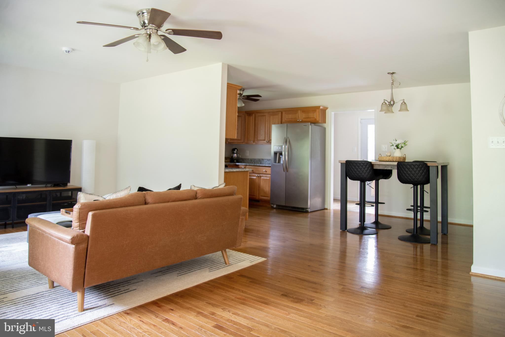 5588 Courtneys Corner Road Sumerduck, VA 22742 - Photo 5 of 22 a living room with furniture and a flat screen tv