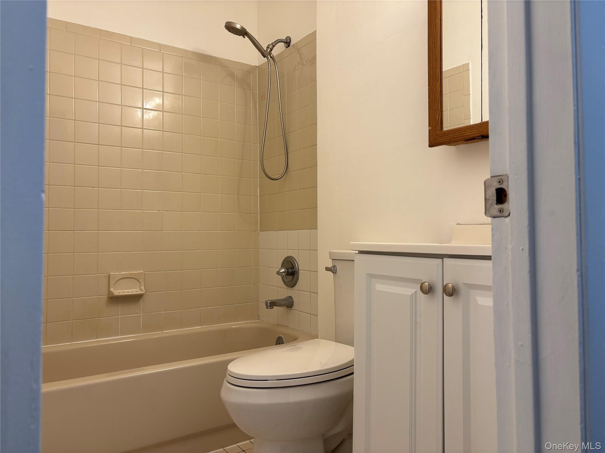 679 A Meadow Road Smithtown, NY 11787 - Photo 13 of 30 Full bathroom featuring shower / washtub combination, vanity, and tile patterned flooring