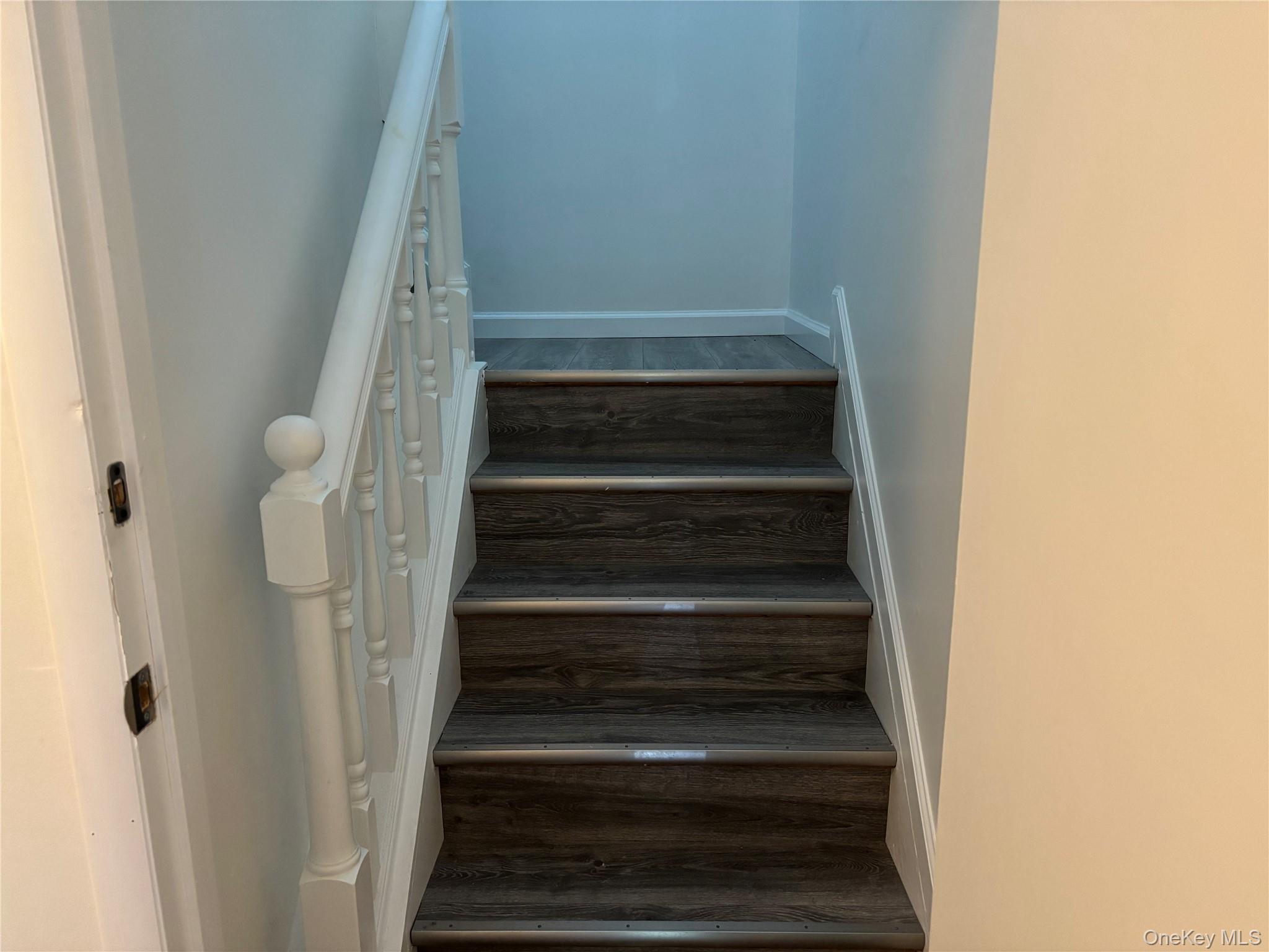 679 A Meadow Road Smithtown, NY 11787 - Photo 14 of 30 Staircase with wood finished floors