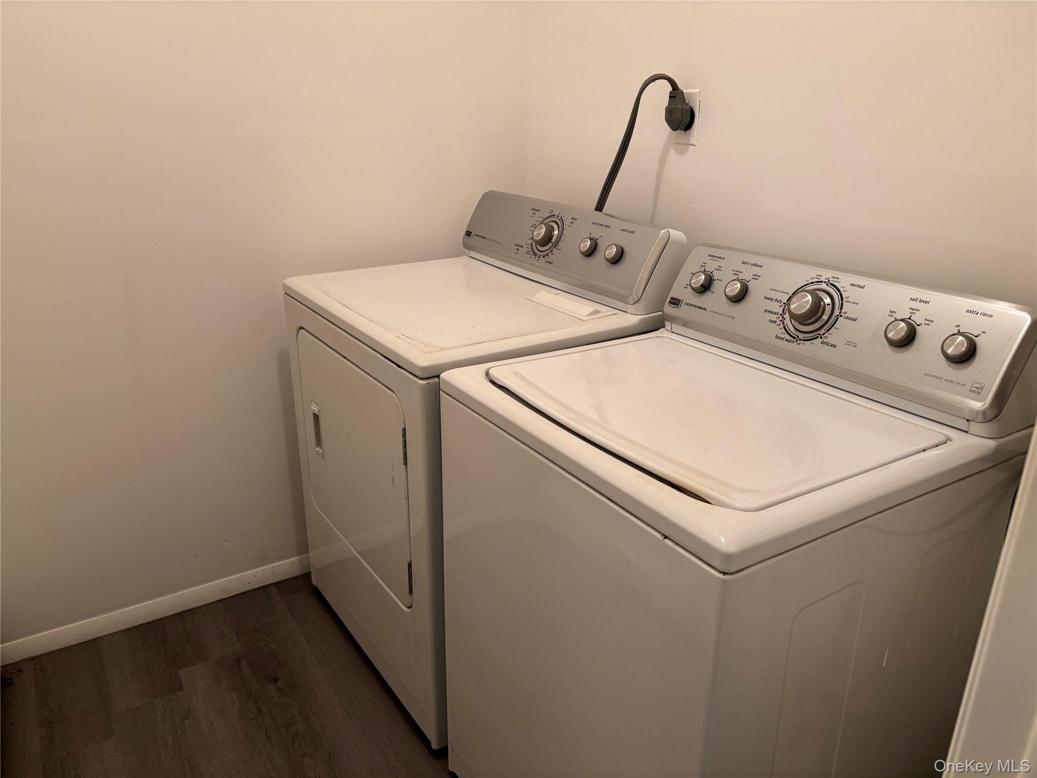679 A Meadow Road Smithtown, NY 11787 - Photo 28 of 30 Laundry room featuring dark wood-style floors and washer and dryer