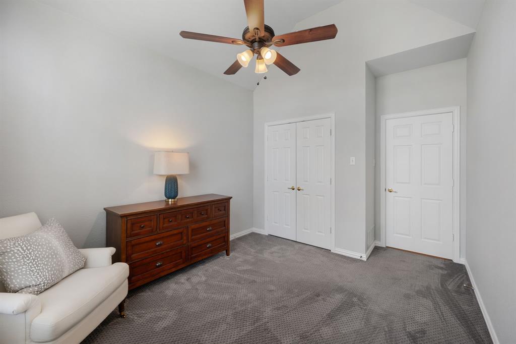 965 Stonecrest Road Argyle, TX 76226 - Photo 24 of 29 Bedroom featuring lofted ceiling, carpet, and ceiling fan