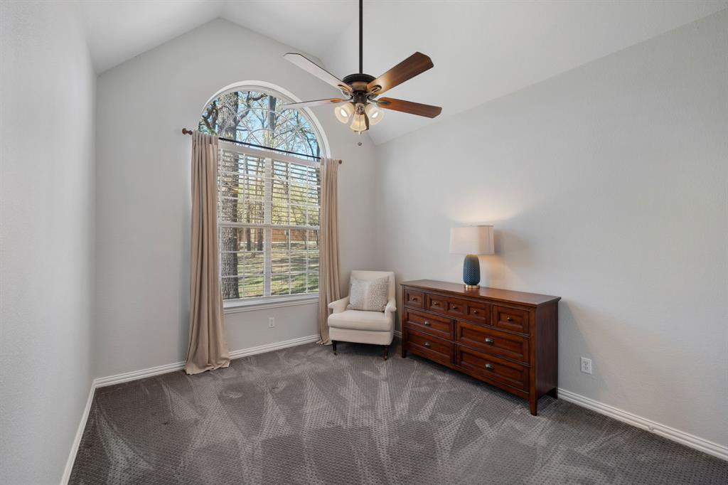 965 Stonecrest Road Argyle, TX 76226 - Photo 24 of 30 a living room with furniture a window and a chandelier