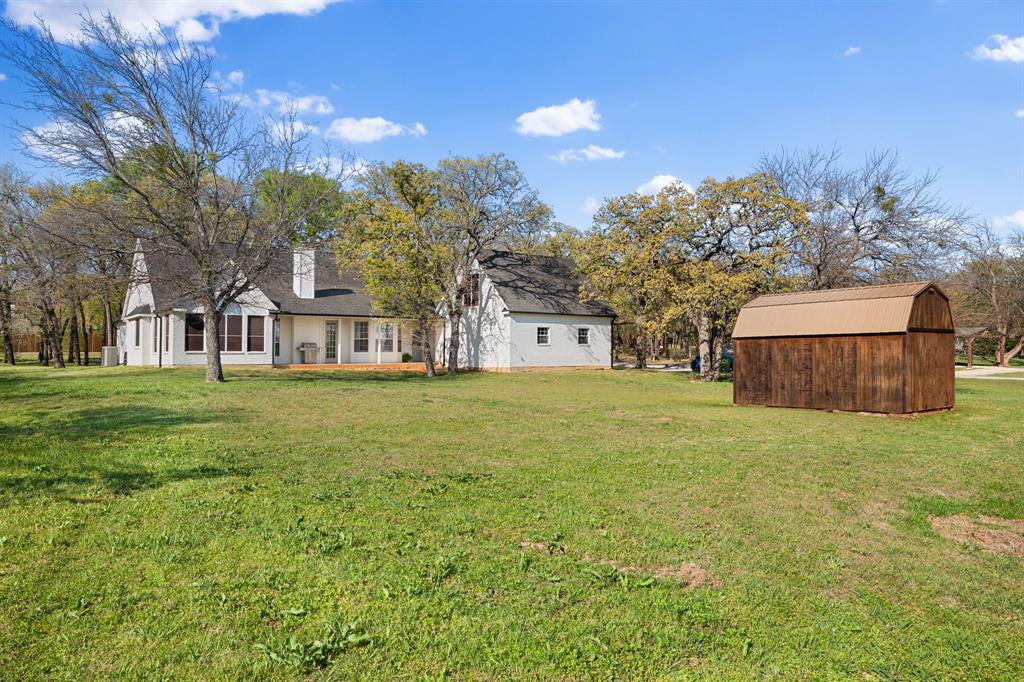 965 Stonecrest Road Argyle, TX 76226 - Photo 25 of 29 Enjoy the outdoors with this large lawn with a shed and a patio area