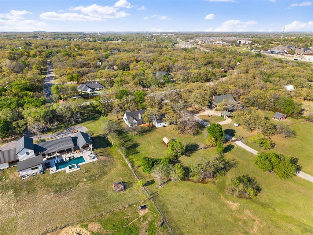 965 Stonecrest Road Argyle, TX 76226 - Photo 28 of 30 an aerial view of residential houses with outdoor space and trees