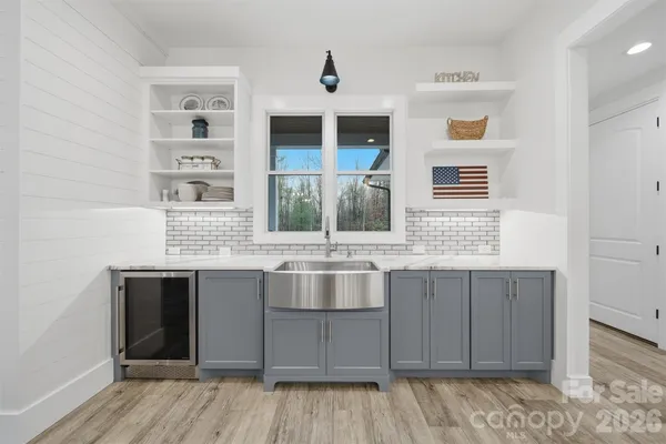 a kitchen with a sink and cabinets