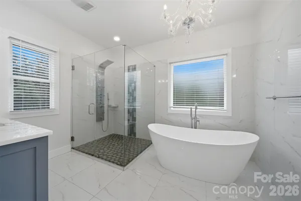 a bathroom with a bathtub and window