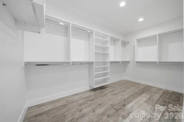 a view of a room with shelf on the wall