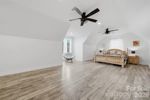 a living room with couch and a ceiling fan