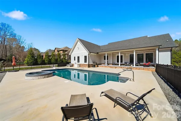 a view of house with yard outdoor seating and entertaining space