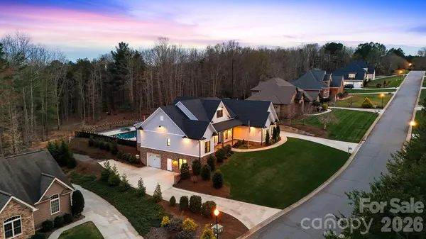 a aerial view of a house with garden space and street view