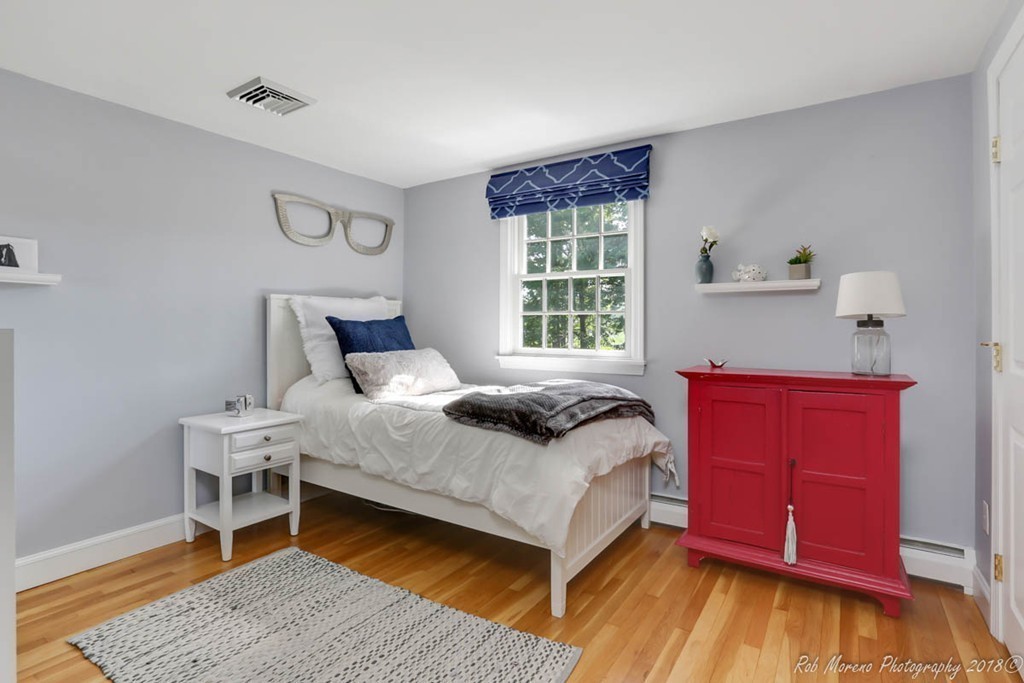 20 Wilmor Road Topsfield, MA 01983 - Photo 16 of 30 a bedroom with a bed and wooden floor