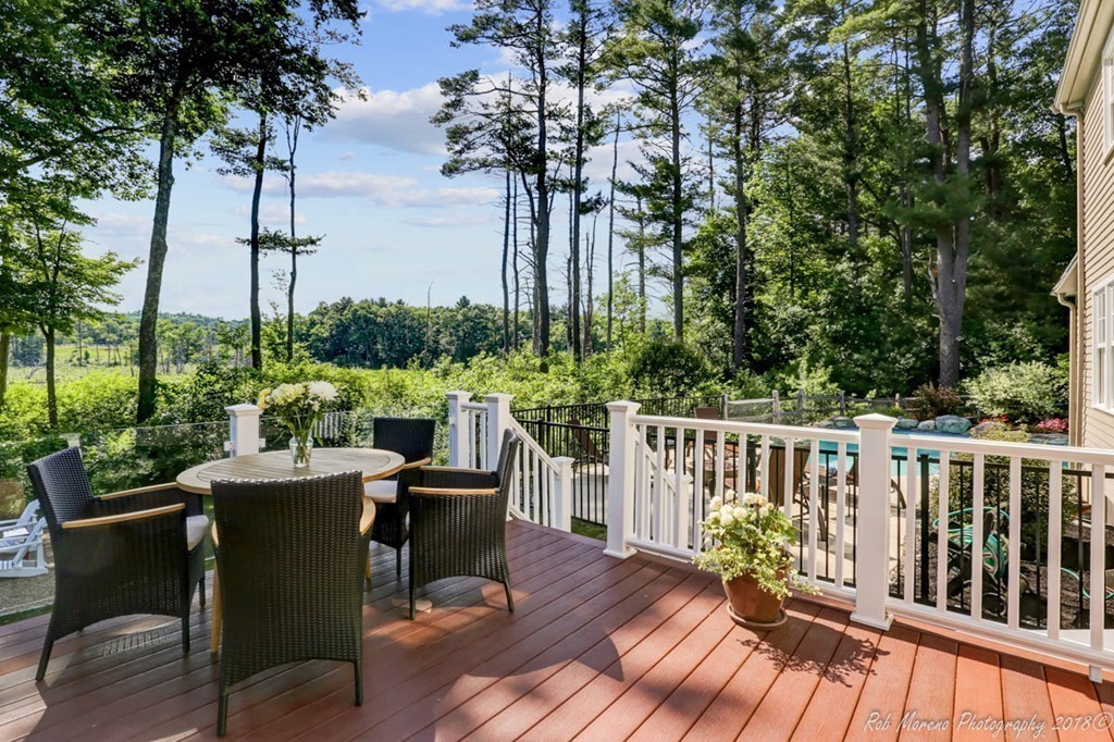 20 Wilmor Road Topsfield, MA 01983 - Photo 22 of 30 a view of a chairs and table on the wooden deck