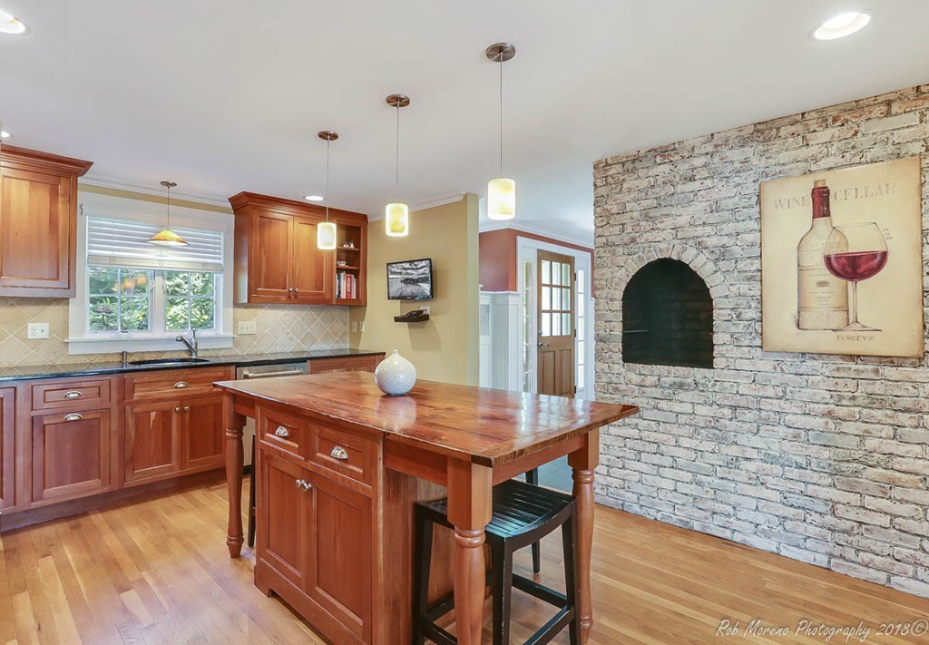 20 Wilmor Road Topsfield, MA 01983 - Photo 3 of 30 a kitchen with stainless steel appliances granite countertop a table chairs and a refrigerator