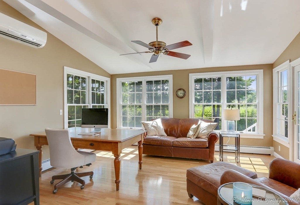 20 Wilmor Road Topsfield, MA 01983 - Photo 10 of 30 a living room with furniture and a floor to ceiling window