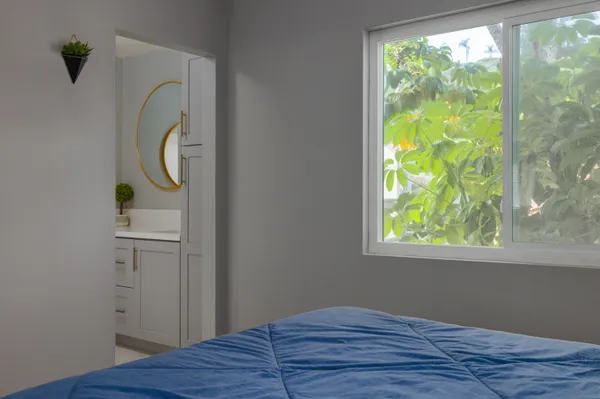 a room that has a window and wooden floor