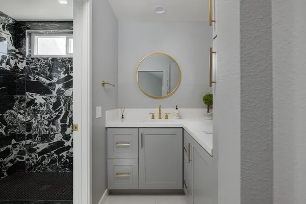 a bathroom with a sink and a mirror