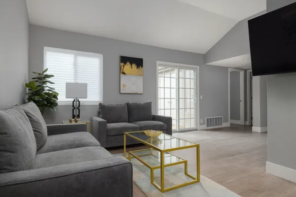 a living room with furniture and a window