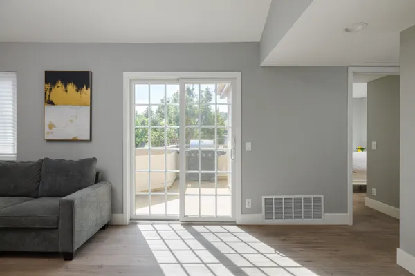 a living room with furniture and a window