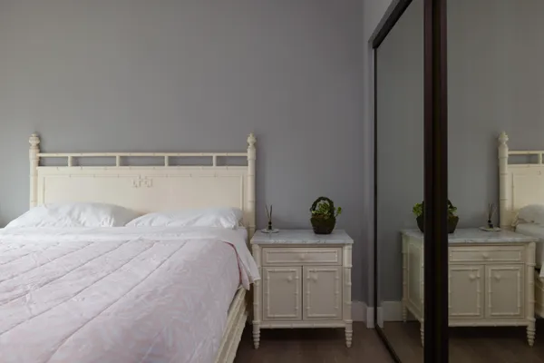 a bedroom with a bed and a dresser